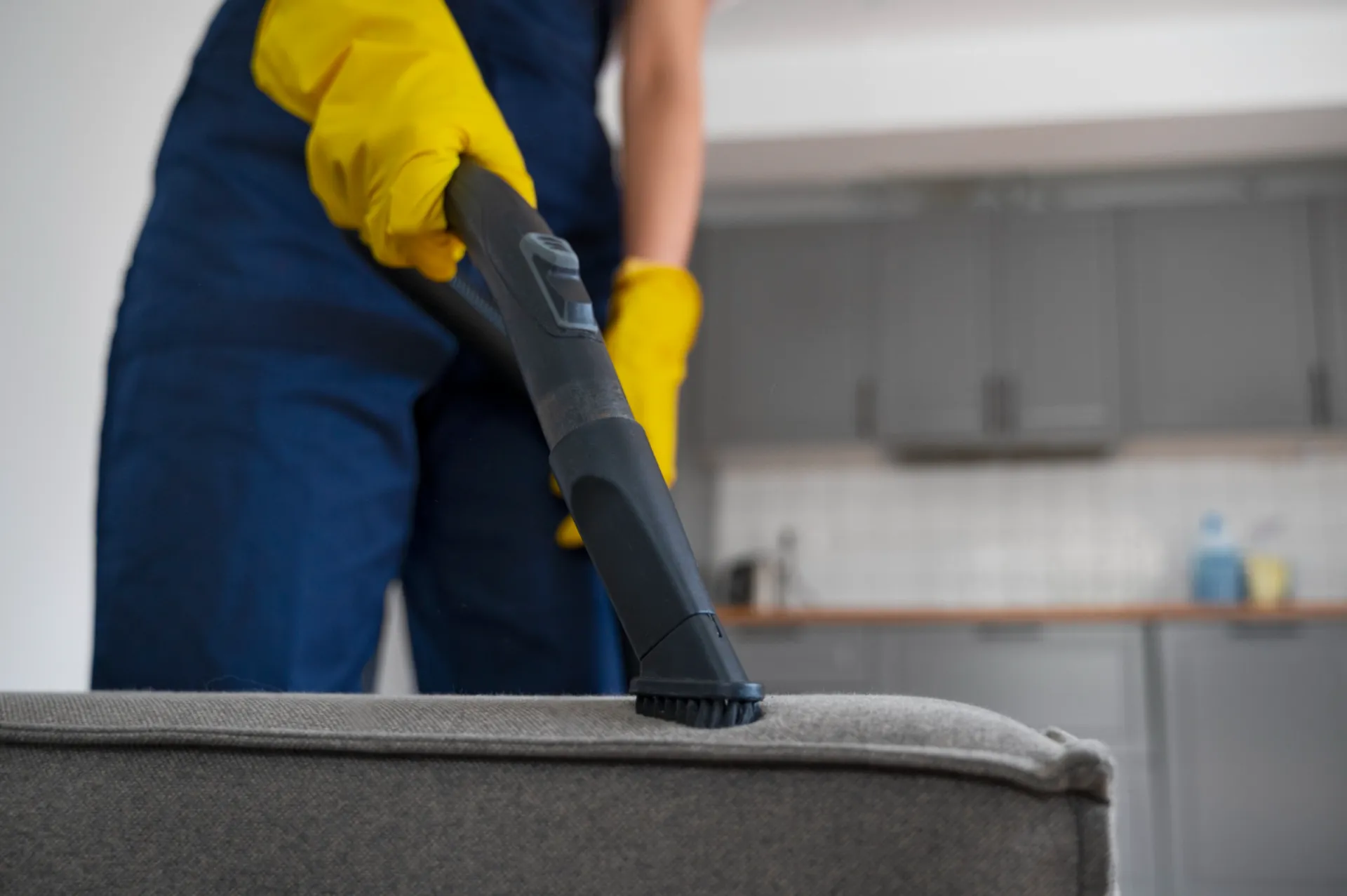 professional upholstery cleaning service in Harrow London cleaning sofa with vacuum