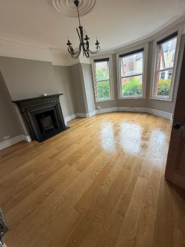 after builders cleaning in London, removing dust from a newly renovated room